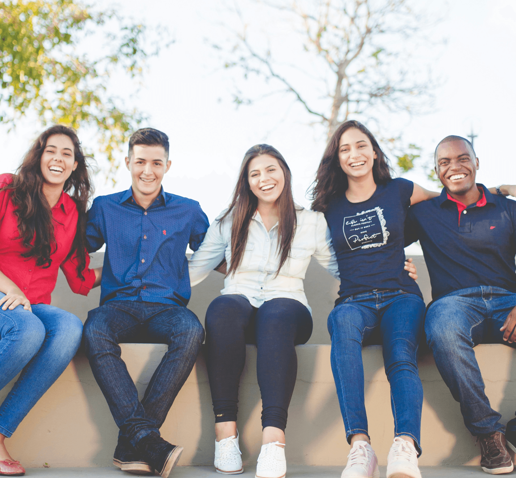 People sitting on a wall